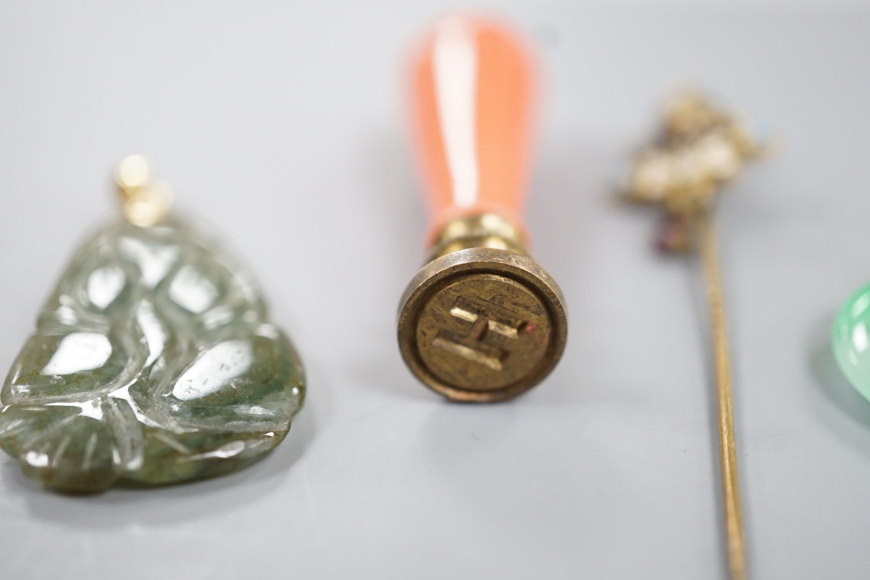An 18k mounted jade set teardrop shaped pendant, 36mm and three other items of jewellery, including a seal and stick pin.